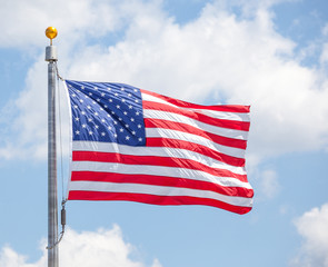 American flap flapping on blue sky