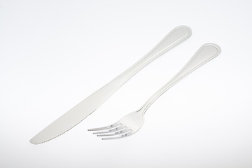a silver fork with knife isolated on white background