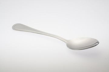 a silver spoon isolated on white background