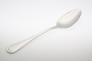 a silver spoon isolated on white background