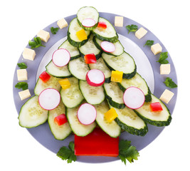 Christmas tree from cucumber on plate isolated on white