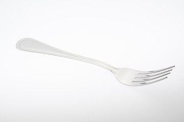 a silver fork  isolated on gray background