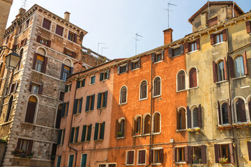 Facades of houses on a street in Venice, Italy