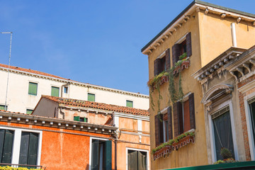 Facades of houses on a street in Venice, Italy