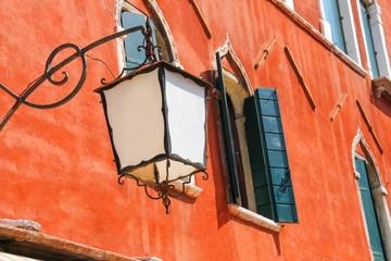 Fototapeta premium Lantern on the facade of old italian house. Venice