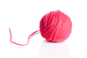Red wool yarn ball isolated on white background