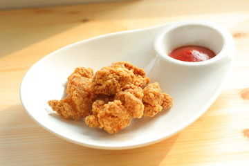 Deep fried chicken with ketchup