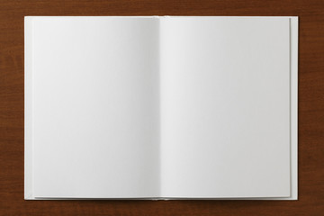 Blank open Book on a wooden table