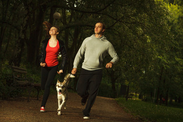 Fototapeta premium Happy family with dog, in the park