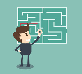 Businessman finding the solution of a maze