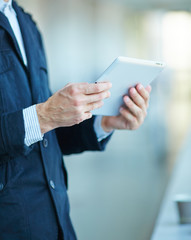 men holding digital tablet