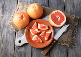 Ripe grapefruits and knife