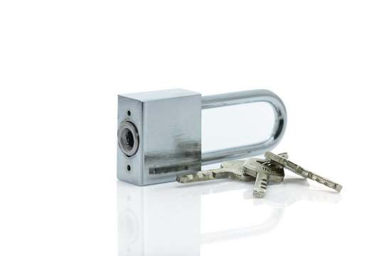 Padlock with three keys on white background