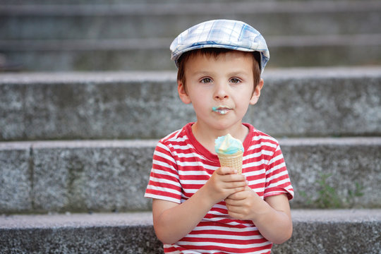 Adorable little boy, eating ice cream