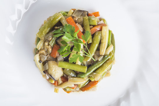 Timbal de verduras salteadas con aceite de oliva