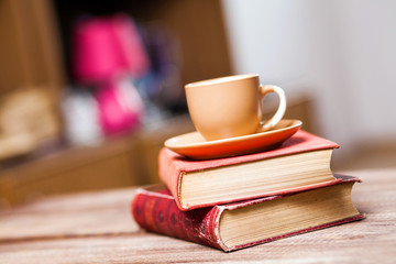 Naklejka premium Books and a coffee cup