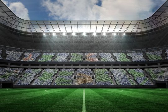 Large football stadium under spotlights