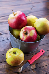 Fresh apples in metallic can