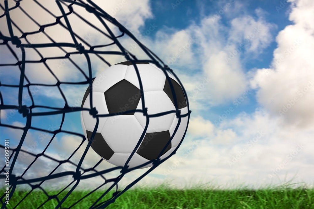 Poster Composite image of football in back of the net