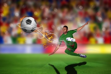 Composite image of football player in green kicking