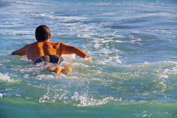 Surfer on Blue Ocean Wave in Bali