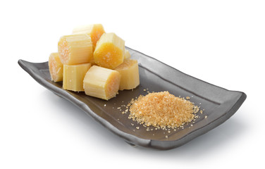 sugar cane on black plate