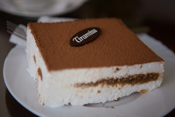 Cup of coffee, cake and spring flowers