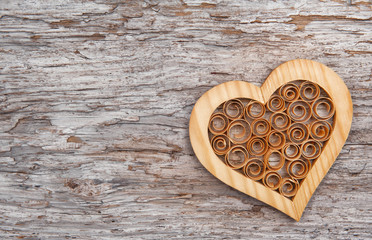 Wooden decorative heart on the old wood