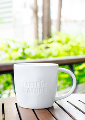 White ceramic mug with stamp word 
