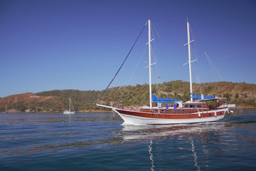 Fototapeta na wymiar Motor and sailing yacht. Fetkhiye, Turkey