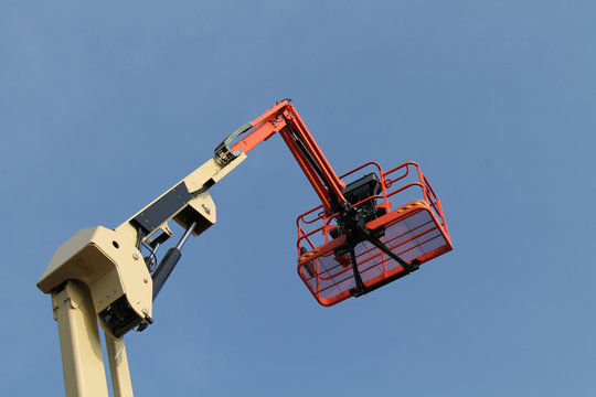 The Cage and Arm of a Mechanical Cherry Picker Lift.