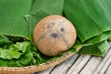 Peeled coconut on bamboo table