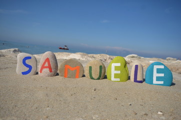 Fototapeta na wymiar Samuele, male name on colored stones