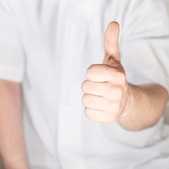 Thumbs up hand gesture