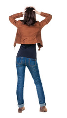 Back view of shocked woman in blue jeans.