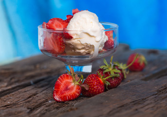 Ice cream with strawberries and whipped cream