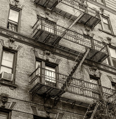 Building with green ladders for fire escape, Mott Street New Yor