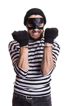 Angry robber with handcuffs