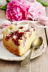 Piece of strawberry cake on ceramic plate