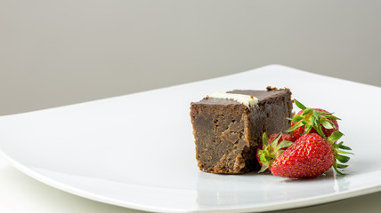 Chocolate brownie and strawberries