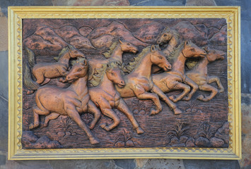 Low relief cement Thai style handcraft of horse