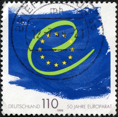 stamp printed in Germany shows flag and symbol of Europe