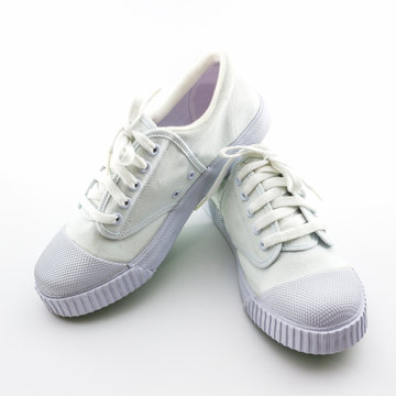 White sport shoes on white background.