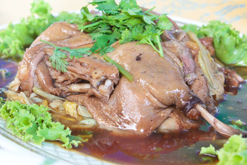 Baked duck stuffed with chinese flowers.