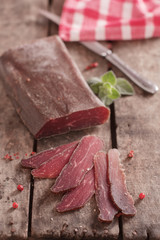 Traditional Bulgarian dried meat decorated with pink pepper