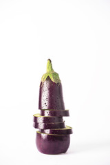 Aubergine(eggplant) slices on a white background.