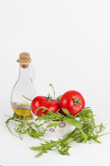 fresh summer salad: red ripe tomatoes, rucola salad and olive oi