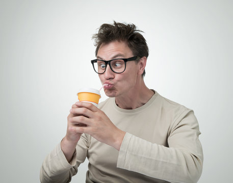 Funny Man In Glasses Drink Through A Straw