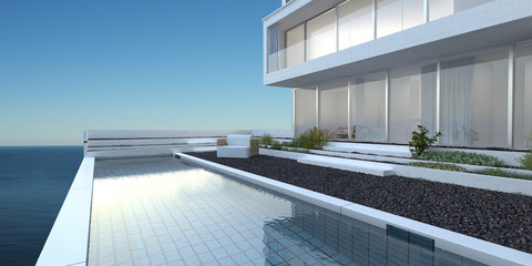 House with patio and pool overlooking the sea
