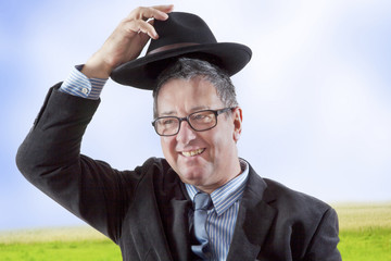 Fototapeta premium Man lifts hat in greeting